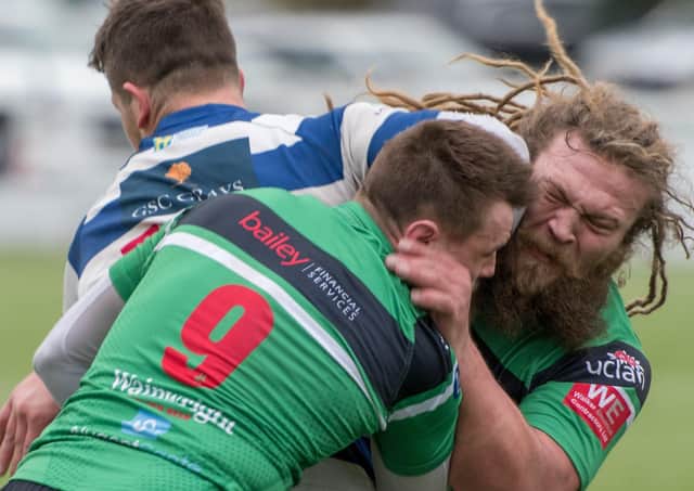 Hoppers (in green) make a tackle against Tynedale (photo: Mike Craig)