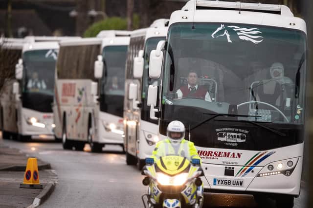 A convoy of coaches transporting eighty-three Britons and 27 foreign nationals who have been evacuated from Wuhan following a Coronavirus outbreak (Photo by Leon Neal/Getty Images)