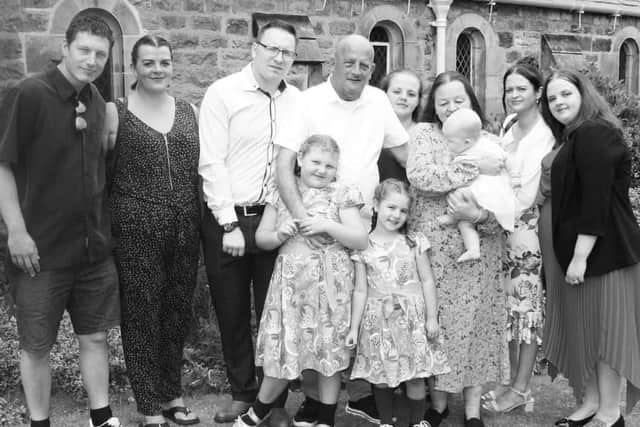 The Bowers family, from left, Dan, Claire, Rob, Alan, Hannah, Tina, Julianne and Jessica. Front are grandchildren Isabelle and Ella, with baby Esther in Tina's arms.