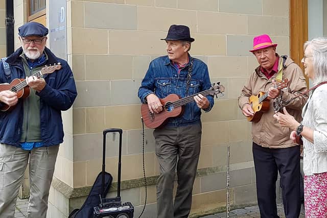 Members of Traffic Jam busking in the street - Bob Sapey is pictured second from left. (photo: David Parry)