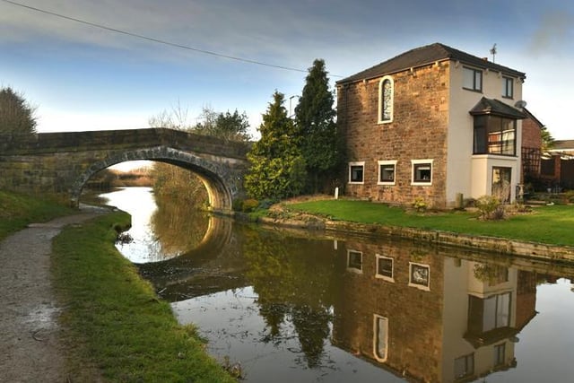 Public road bridge over Lancaster Canal. 1797; engineer John Rennie. Large rock-faced sandstone blocks