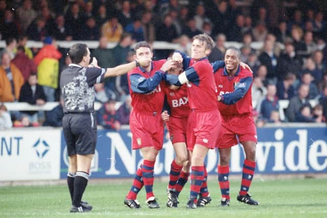 Lee Cartwright is congratulated by his Preston team-mates