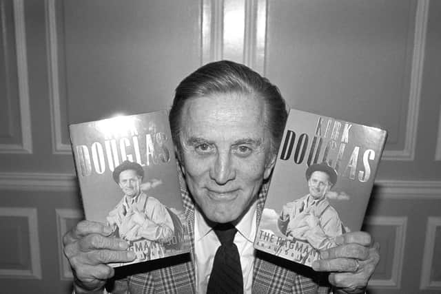 Kirk Douglas with copies of his autobiography The Ragman's Son at Harrods Department Store.