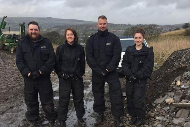 Officers with the local neighbourhood policing team pose outside the undisclosed site of an alleged cannabis cultivation site in rural Colne on Tuesday (February 4)