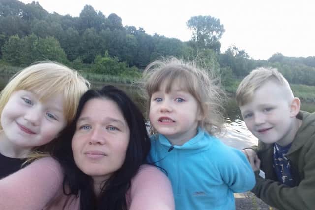 Joanne Brooks, pictured with her three youngest children during the search for Michael in 2018