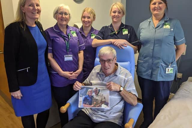 Keith Ainsworth with staff at St John's Hospice.