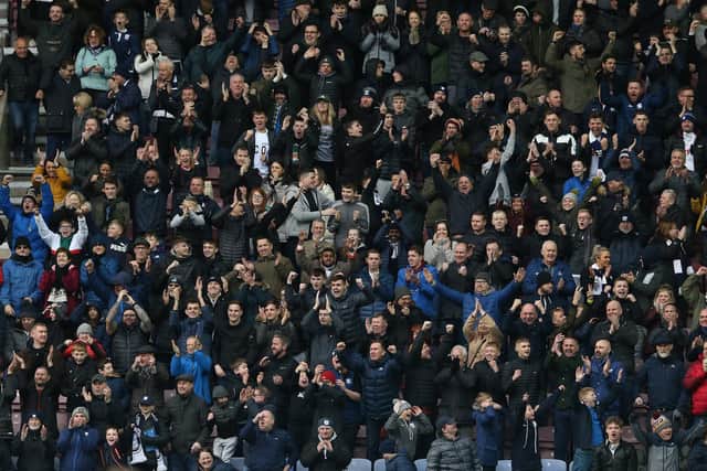PNE fans celebrate their side's victory against Wigan at the DW Stadium