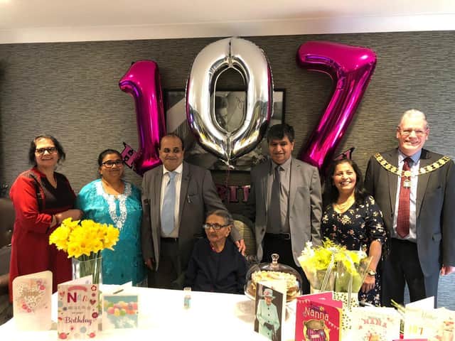 Surrounded by her family and friends, Santa Parekh tots up her years of life with an impressive 107th birthday party