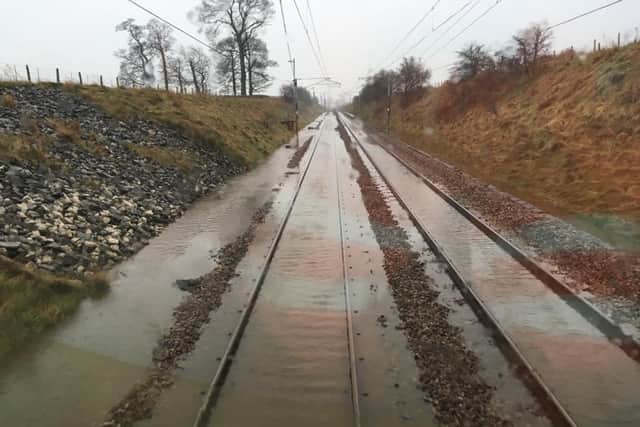 Services between Preston and Manchester are delayed this morning (February 10) due to heavy rain flooding the railway