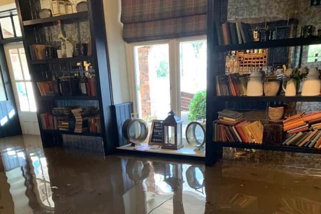 Flood water reaches the windowsills of the Ribchester Arms yesterday (February 9). Pic: @Leanne_Bayes