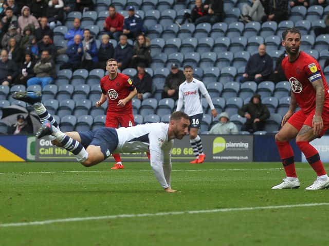 Preston striker Louis Moult heads home against Wigan at Deepdale in August 2019