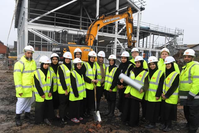 Staff and pupils from Preston Muslim Girls School gathered to buy the time capsule at the site of the new building