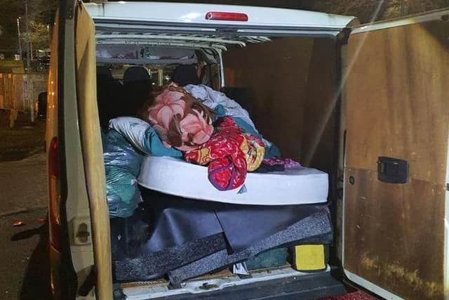 An uninsured van's rear compartment, in which officers found 11 passengers on the M6