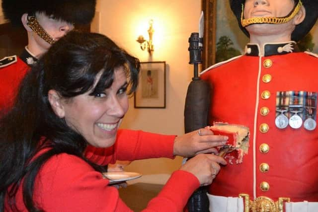 On parade - Rosie takes a slice out of a memorable cake