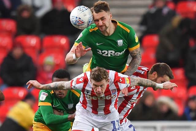 Preston defender Patrick Bauer gets up high to win a header against Stoke