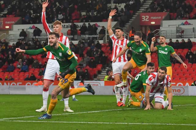 Tom Barkhuizen turns to celebrate after scoring Preston's second goal at Stoke