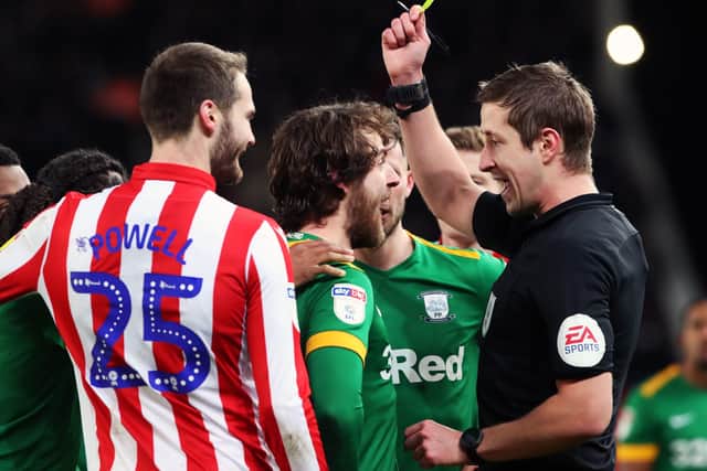 Preston midfielder Ben Pearson is booked during the win at Stoke