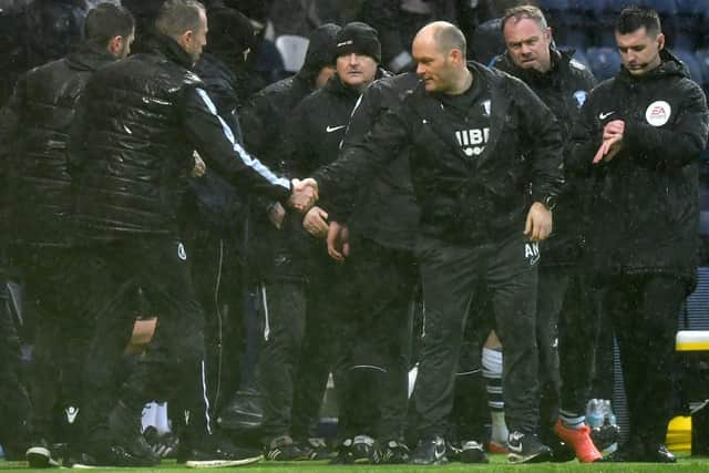 PNE boss Alex Neil shakes hands with Millwall counterpart Gary Rowett