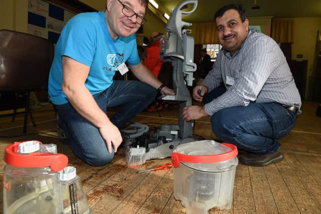 Volunteers Paul Blackett and Abdulla Ismil