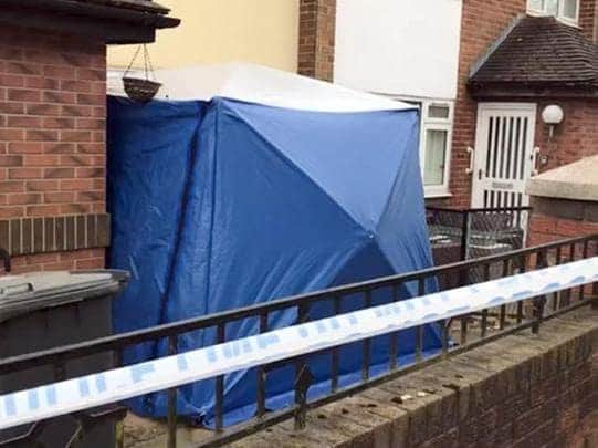 The man was arrested on suspicion of murder after the body of a woman was found at an address in Preston