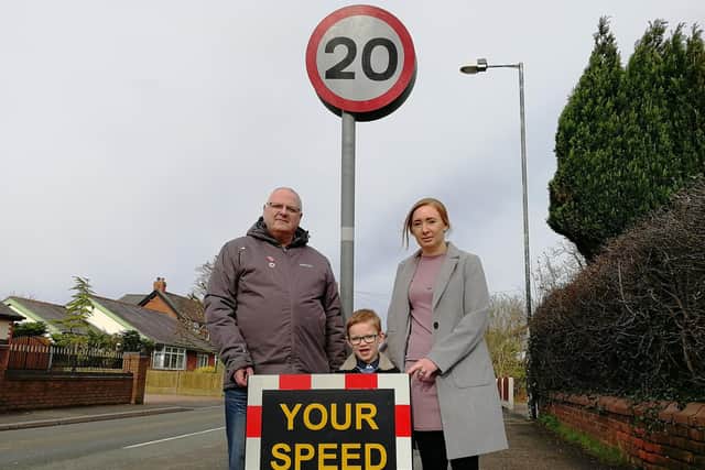 Community speeding campaigner Roger Baines, five-year-old Jack Kirkham and his mum, Sue - with the mobile speed indicator sign that could soon be seen more often on the streets of Larches and Savick