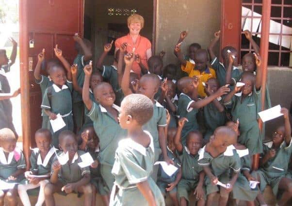 Carolyn Murray with children in South Sudan.