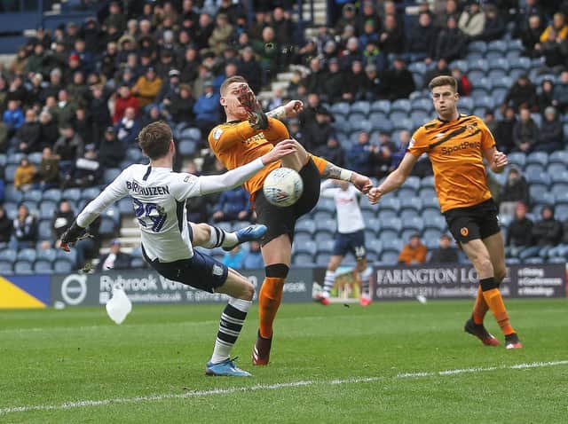 Tom Barkhuizen's route to goal is blocked by Hull City defender Reece Burke
