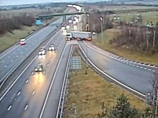 Screengrab from handout CCTV footage issued by Staffordshire Police of a lorry appearing to make a u-turn to merge back onto the M6 Toll motorway.