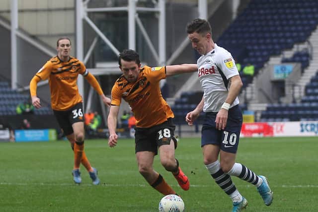 PNE midfielder Josh Harrop looks for a way past Hull's George Honeyman