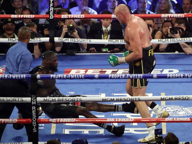 Tyson Fury floors Deontay Wilder