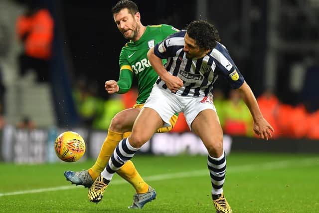 David Nugent challenges for the ball with Ahmed Hegazi.