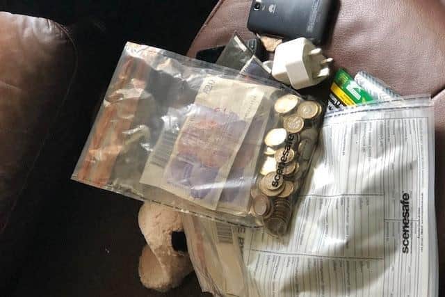 A quantity of suspected Class A drugs, cash, phones and an imitation firearm were seized during the raids. (Credit: Lancashire Police)