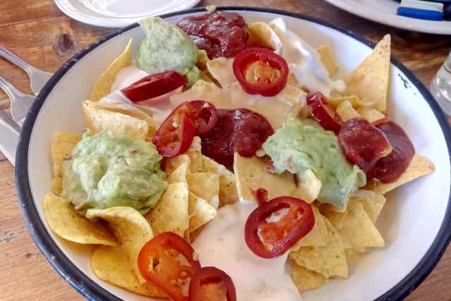 Nacho Sharer For Two with cheddar, guacamole, sour cream, salsa and jalapenos