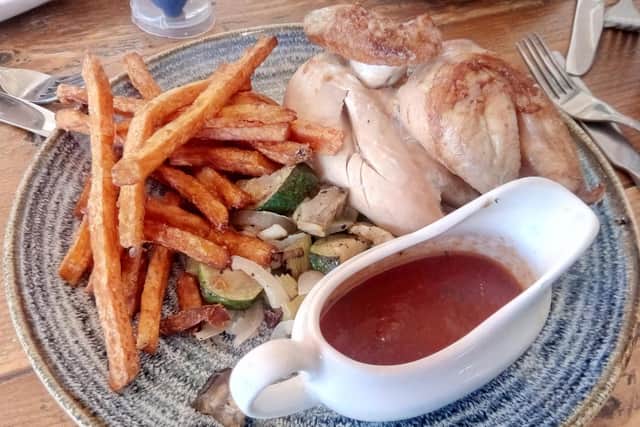 Half rotisserie chicken with roasted veg, sweet potato fries and tomato and rosemary sauce