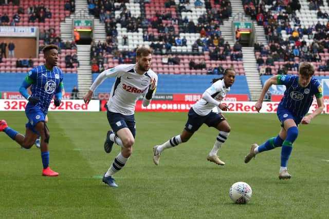 Preston North End's Tom Barkhuizen chases the ball against Wigan. He scored the opening goal of the match and PNE went on to win