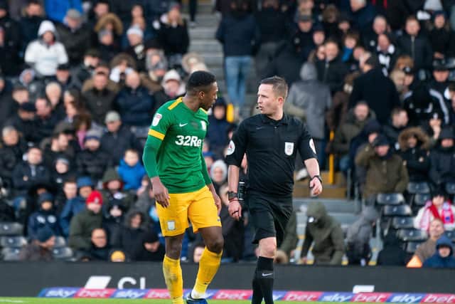 Preston right-back Darnell Fisher has a word with referee David Webb at Craven Cottage