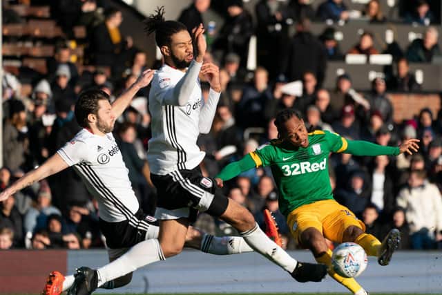 Preston midfielder Daniel Johnson has a shot blocked by Fulham's Michael Hector and Harry Arter at Craven Cottage