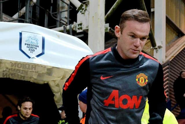 Rooney take to the field against PNE at Deepdale in 2015