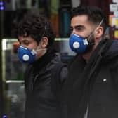 People wearing face masks in east London.