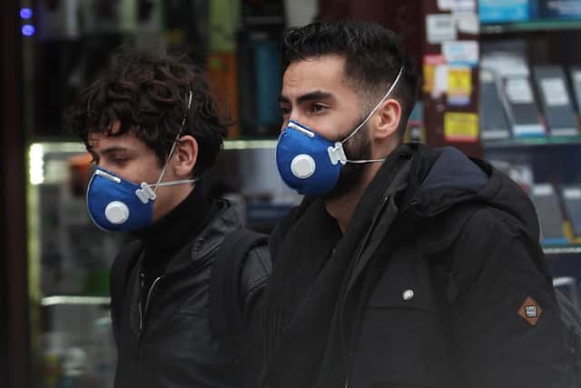 People wearing face masks in east London.