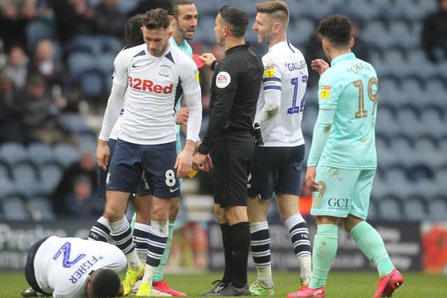 QPR midfielder Geoff Cameron is sent-off against PNE for a foul on Darnell Fisher