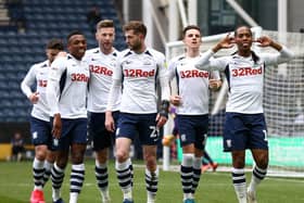 Preston players celebrate after Daniel Johnson scores from the penalty spot against QPR at Deepdale