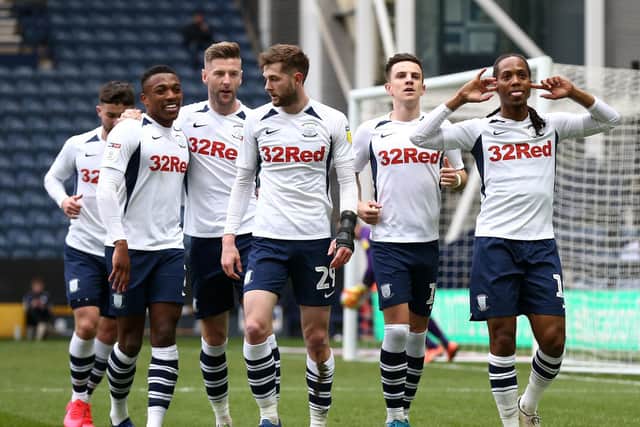 Preston players celebrate after Daniel Johnson scores from the penalty spot against QPR at Deepdale