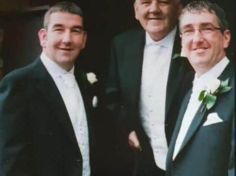 Anthony (left), his father Robbie (centre), and brother Rob (right)