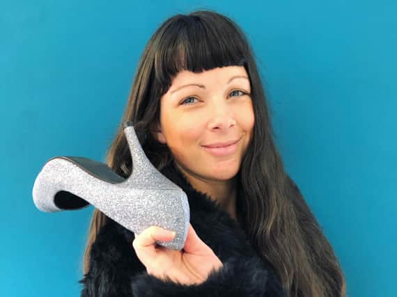 Toria Wilkinson modelling a faux fur coat and shoes from the Age Concern shop in Bamber Bridge.