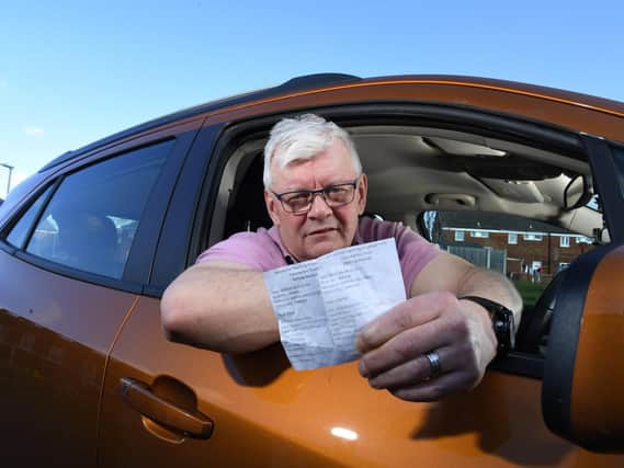 Warren Challinor with his receipts from parking at the Royal Preston Hospital