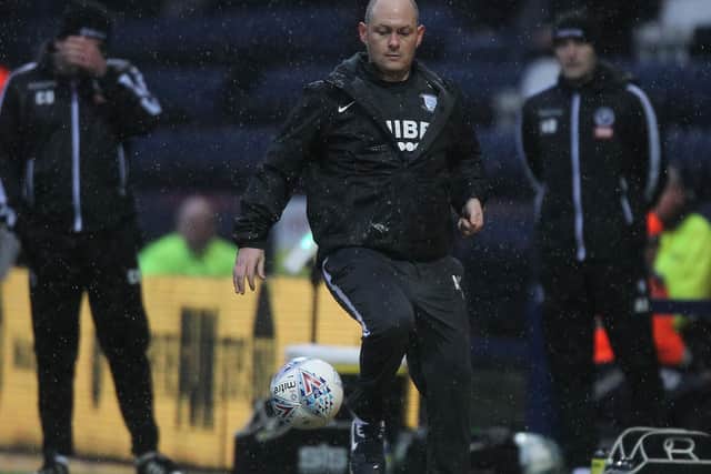 Alex Neil shows some nifty footwork on the touchline