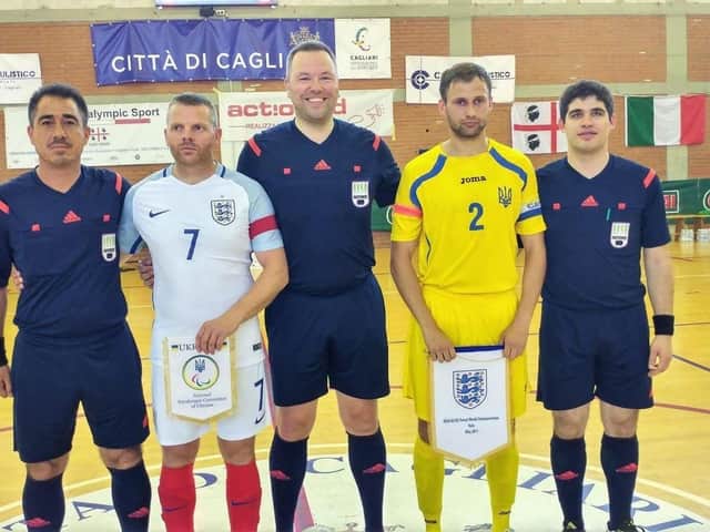 England captain Steve Daley lines up alongside opposing Ukraine captain ahead of the World Cup Futsal final