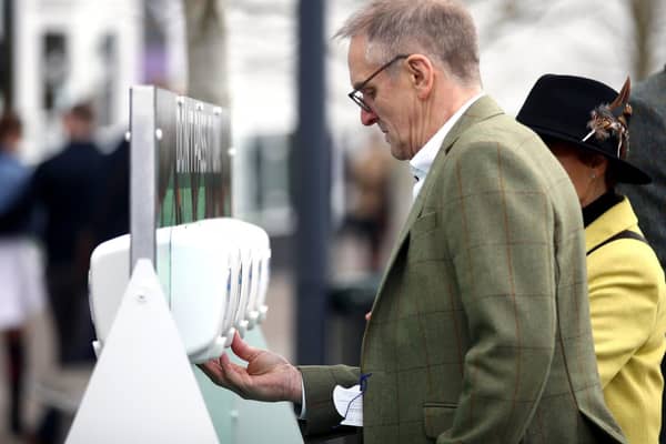Hand sanitising stations, like those used during Cheltenham Festival at Cheltenham Racecourse last week, will be rolled out across Preston in the coming days. Pic: Andrew Matthews/PA Wire
