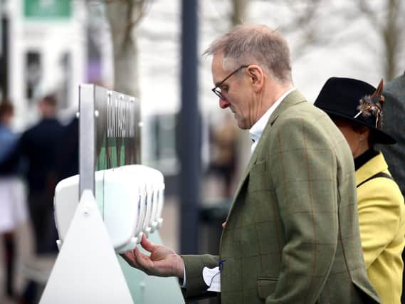 Hand sanitising stations, like those used during Cheltenham Festival at Cheltenham Racecourse last week, will be rolled out across Preston in the coming days. Pic: Andrew Matthews/PA Wire